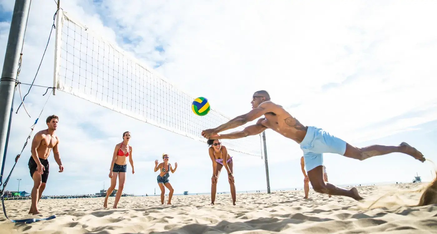 Friends Playing Beach Volleyball