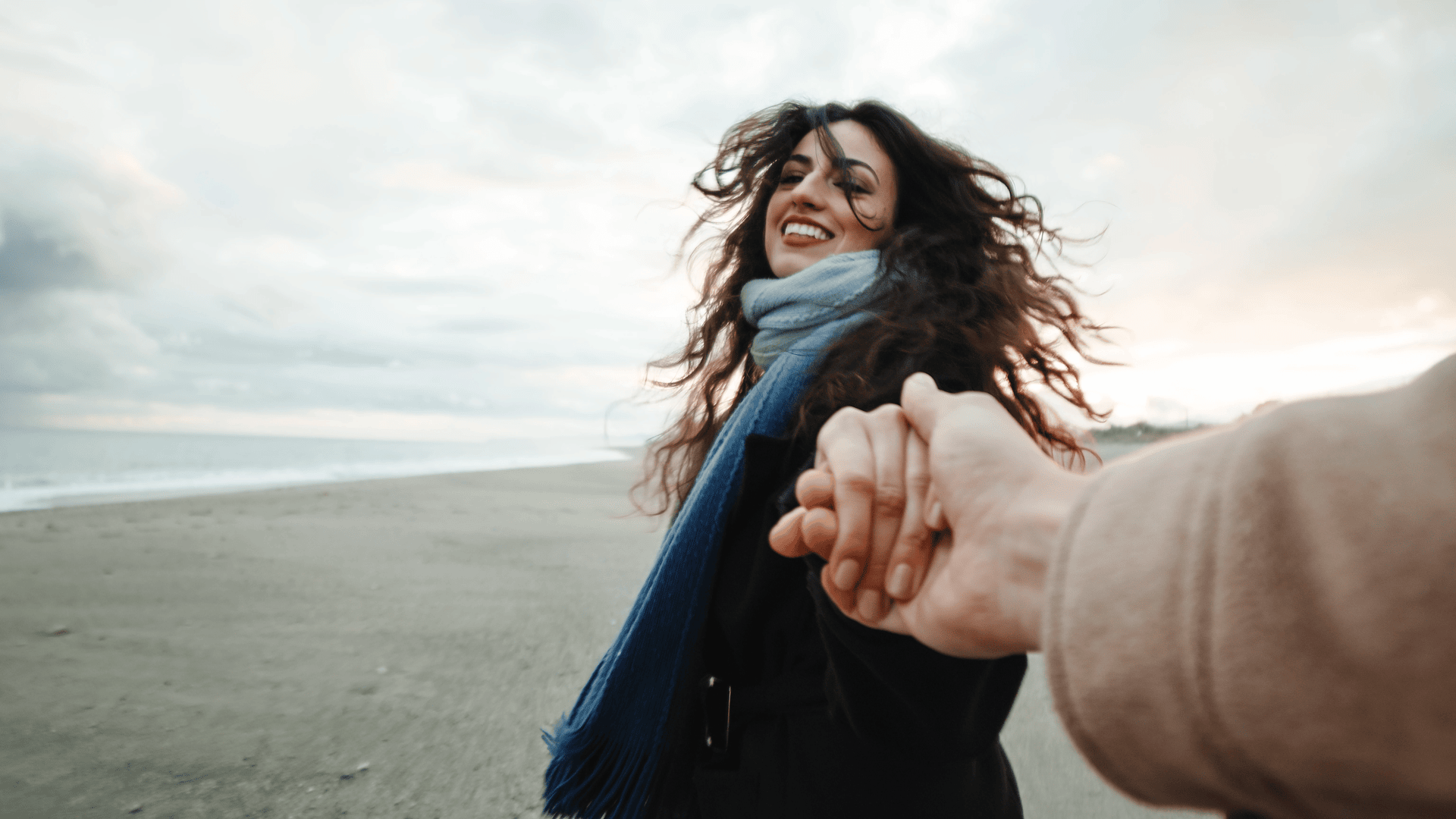 boy-and-girl-walking-on-the-beach-point-of-view