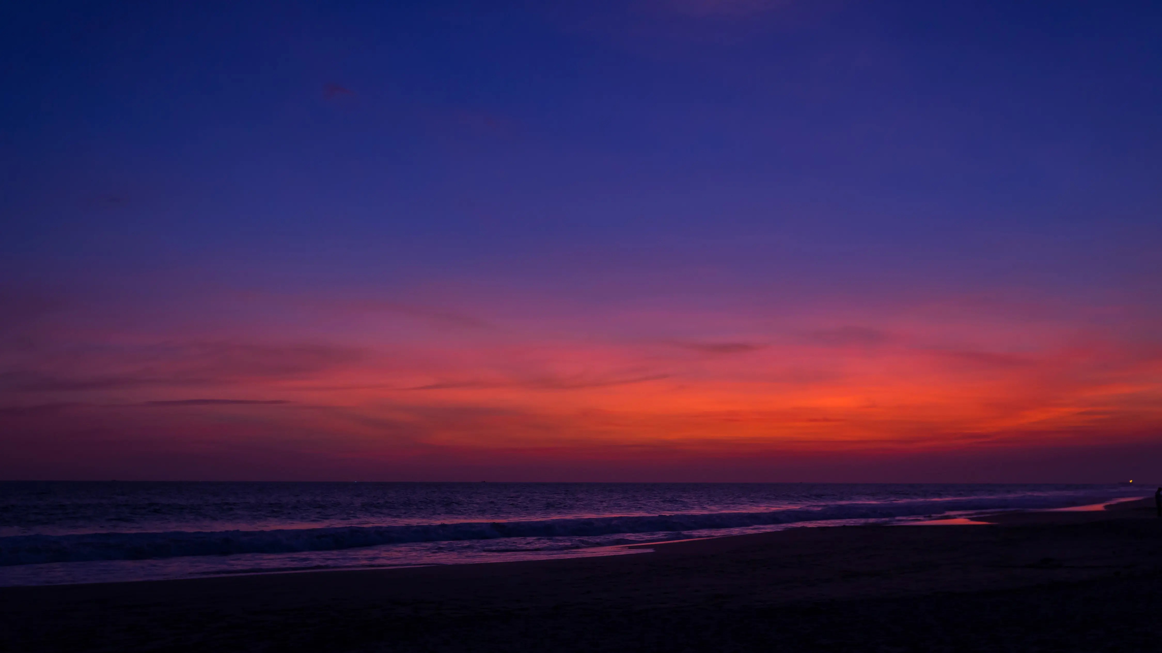 Night View of the Beach with Red Sky