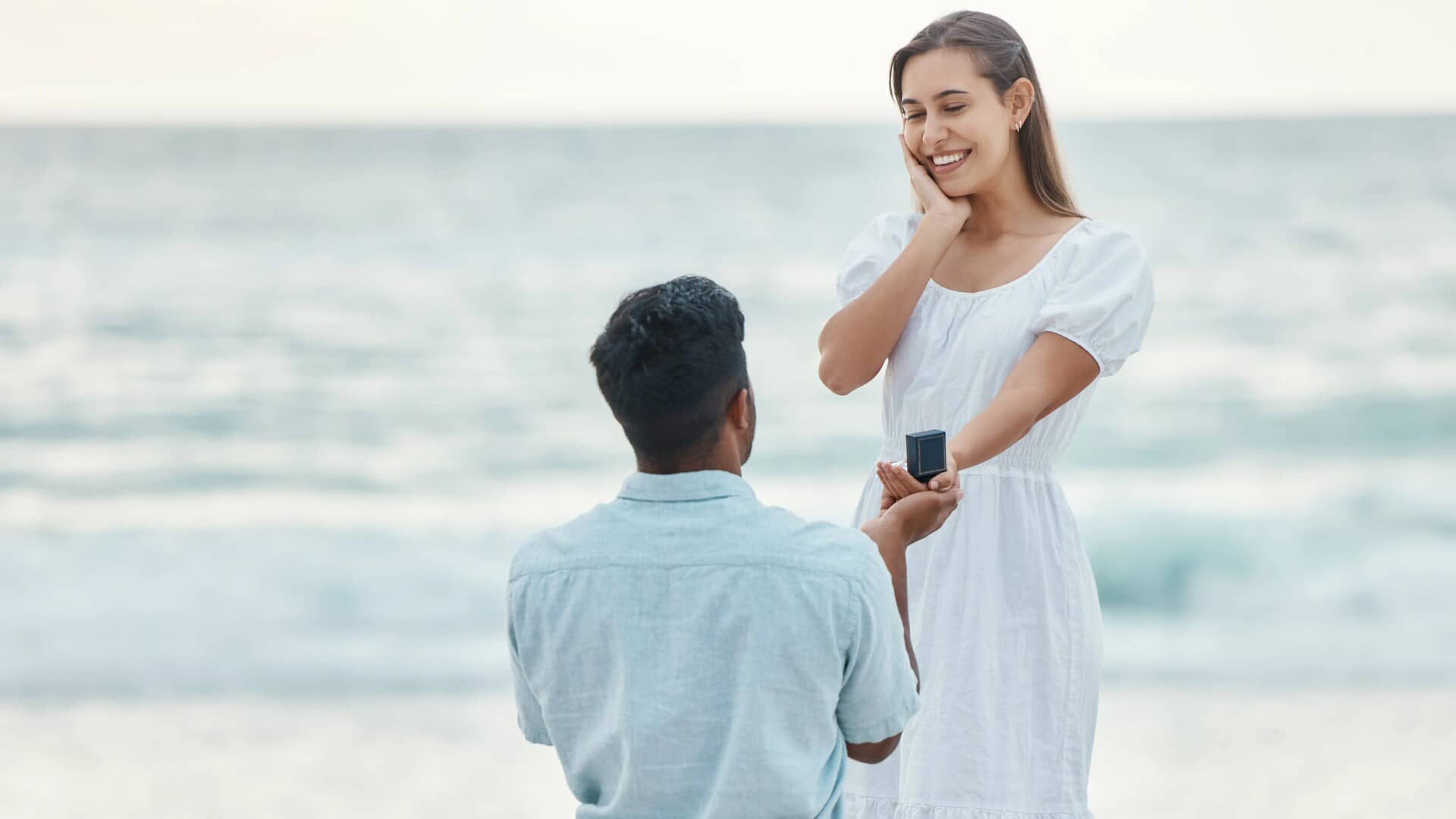 Love Beach and- a Proposal a Couple with Engagement Ring