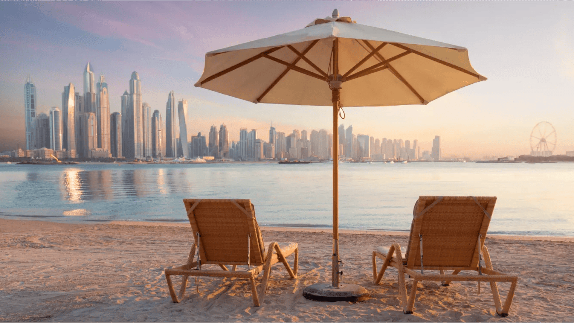 Two Seats and Umbrella on the Beach with Dubai View