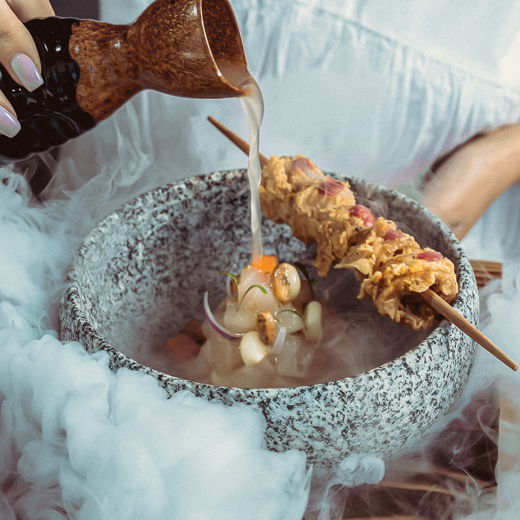 A Dish with Smoke at Playa Restaurant Dubai