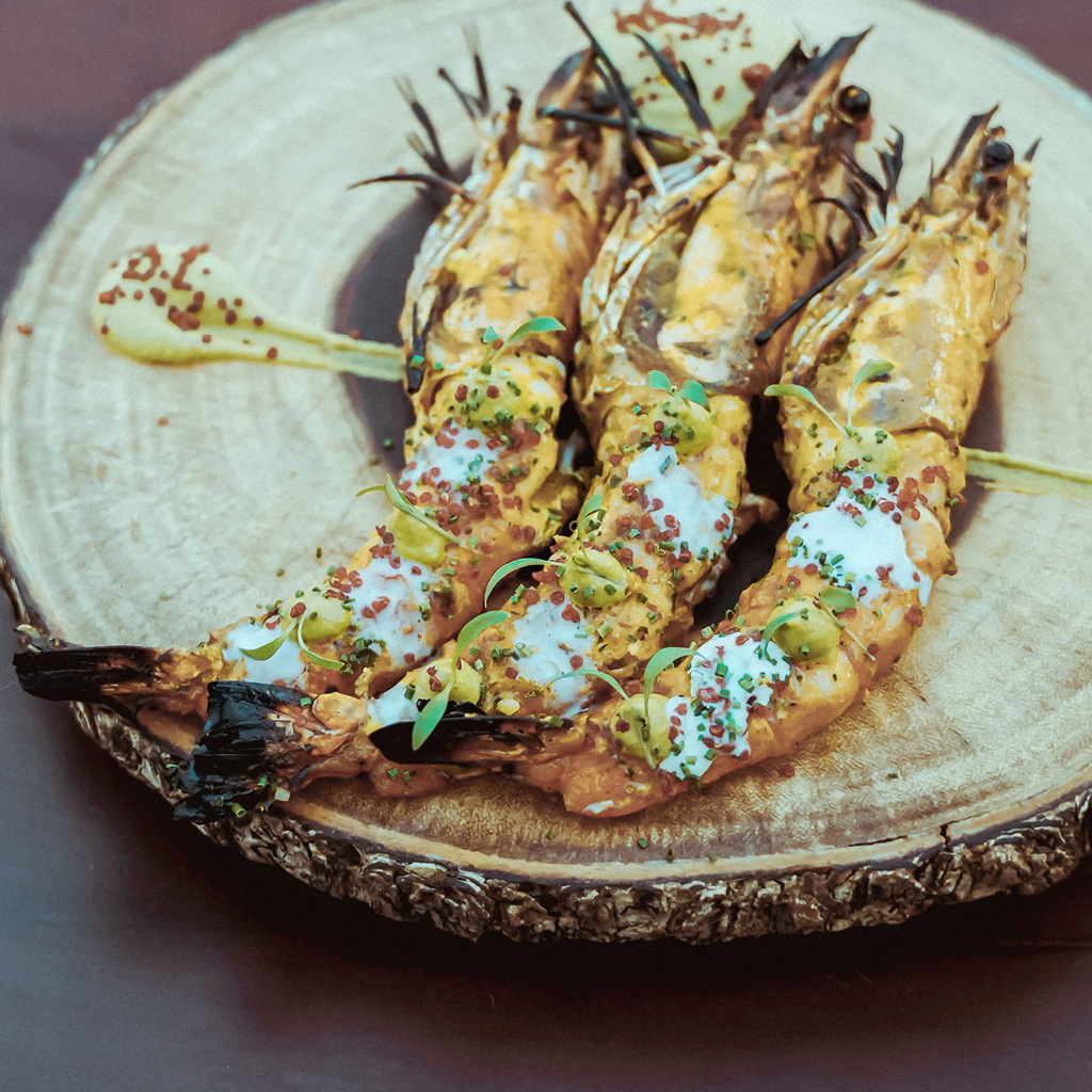 A Three Pieces of Cooked Prawns in a Plate